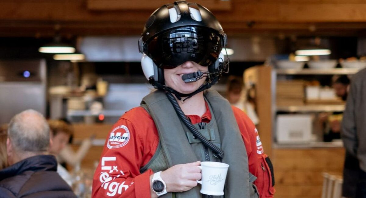 Life Flight Corporate Partner - Flight Coffee - person wearing crew helmet and gear while holding coffee