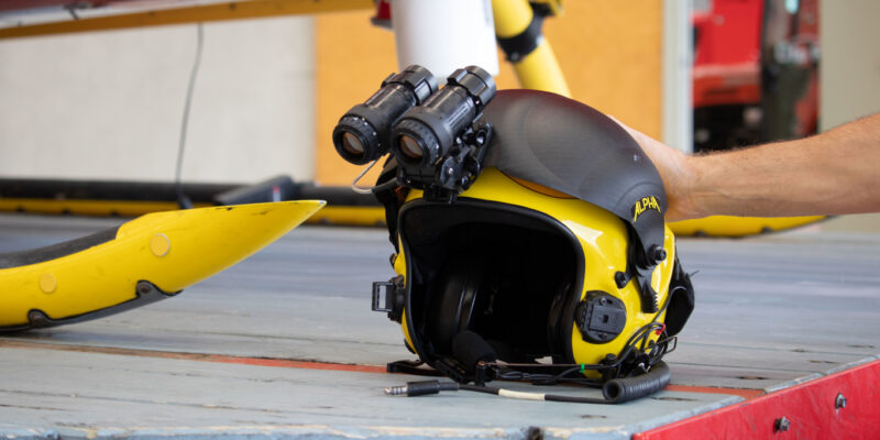 Yellow helmet with night vision goggles attached