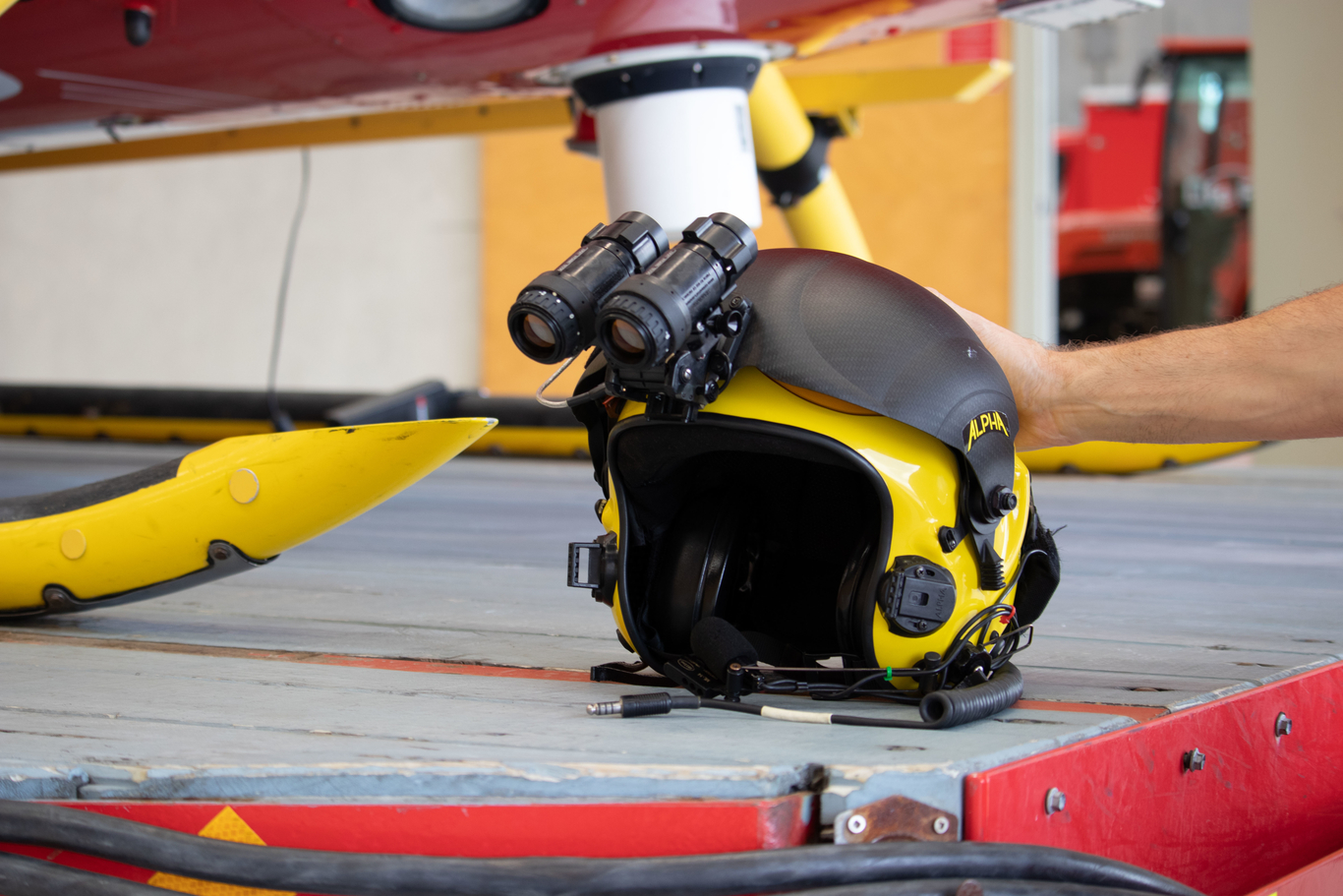 Yellow helmet with night vision goggles attached